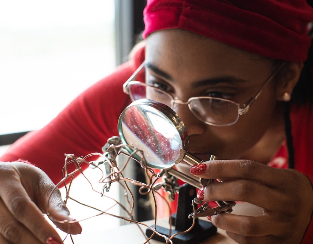 A student working on a wire project in the Fimbel Lab