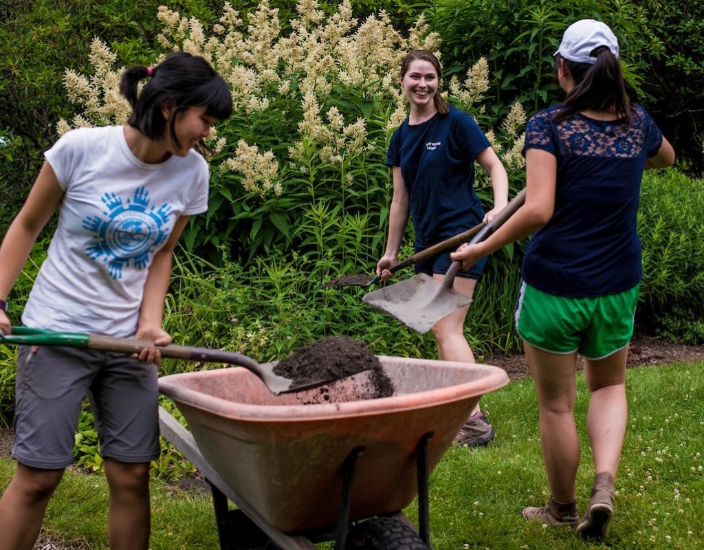 Students working in one of the gardens on campus