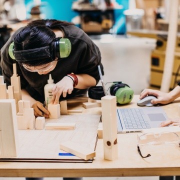 A student works on a wood project in the Fimbel Lab