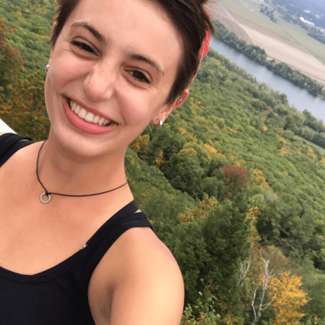 Isabel DiBiasio-Hudson atop Mount Holyoke on Mountain Day
