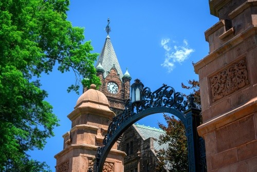 Campus beauty shot of Mount Holyoke's clocktower and gate. Taken in the summer of 2024 by Max Wilhelm.