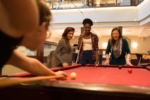 Students playing pool
