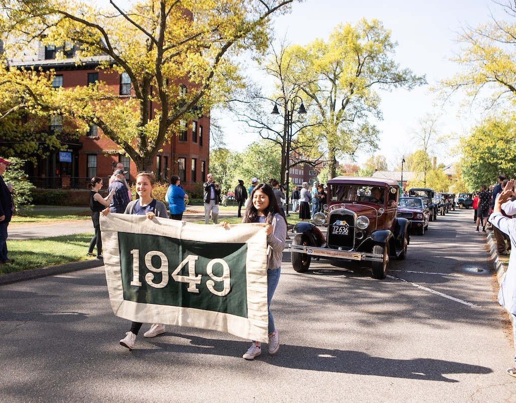 The class of 1949 riding in antique cars during the 2019 Laurel Parade