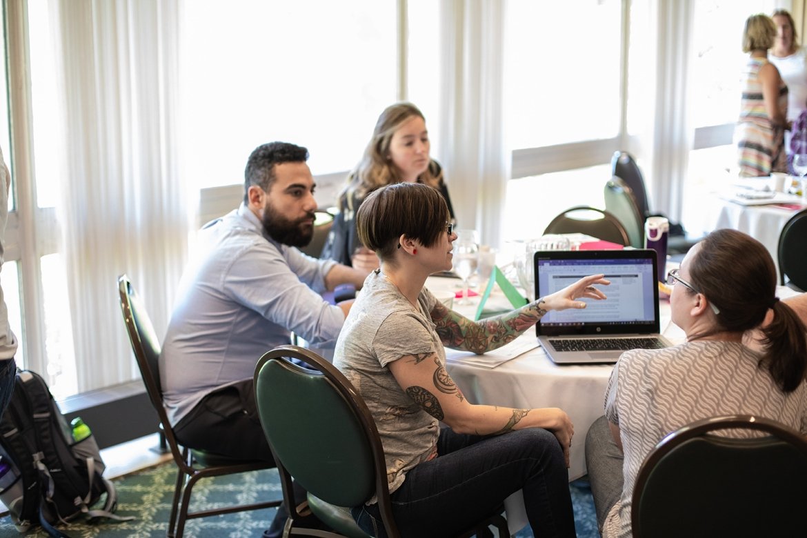 Professional and Graduate students in a discussion.