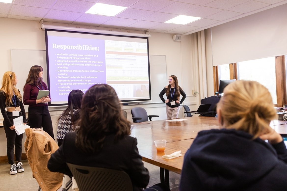 Students presenting in an intimate classrom setting during LEAP Symposium 2022