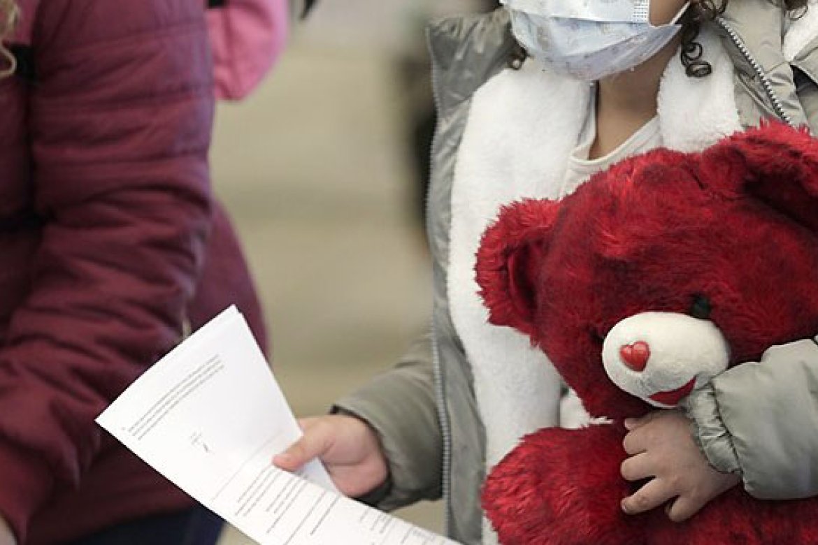 U.S. Customs and Border Protection officers and agents process a small group of asylum-seekers who have active applications under the Migrant Protection Protocols at the Paso del Norte Port of Entry in El Paso, Texas, February 26, 2021. Under the Migrant Protection Protocols established in January, 2019, migrants seeking asylum were required to remain in Mexico while their applications were processed.