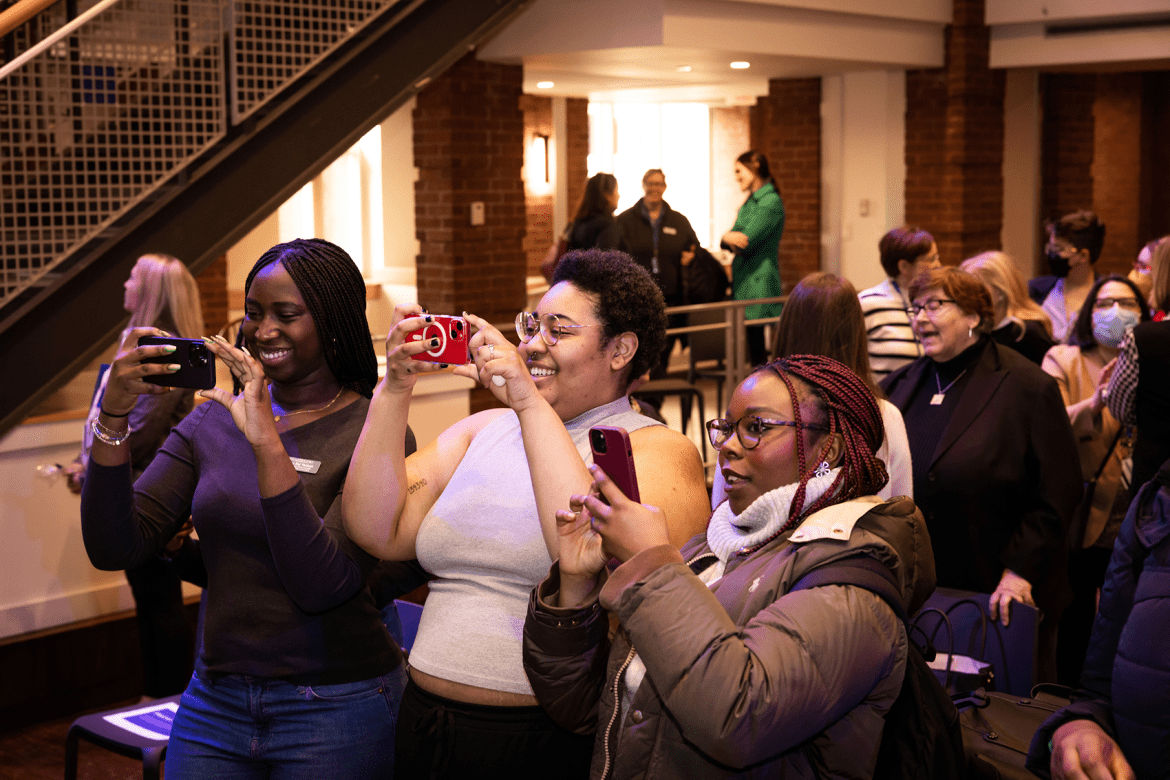 Students snapping photos during the President-elect announcement event