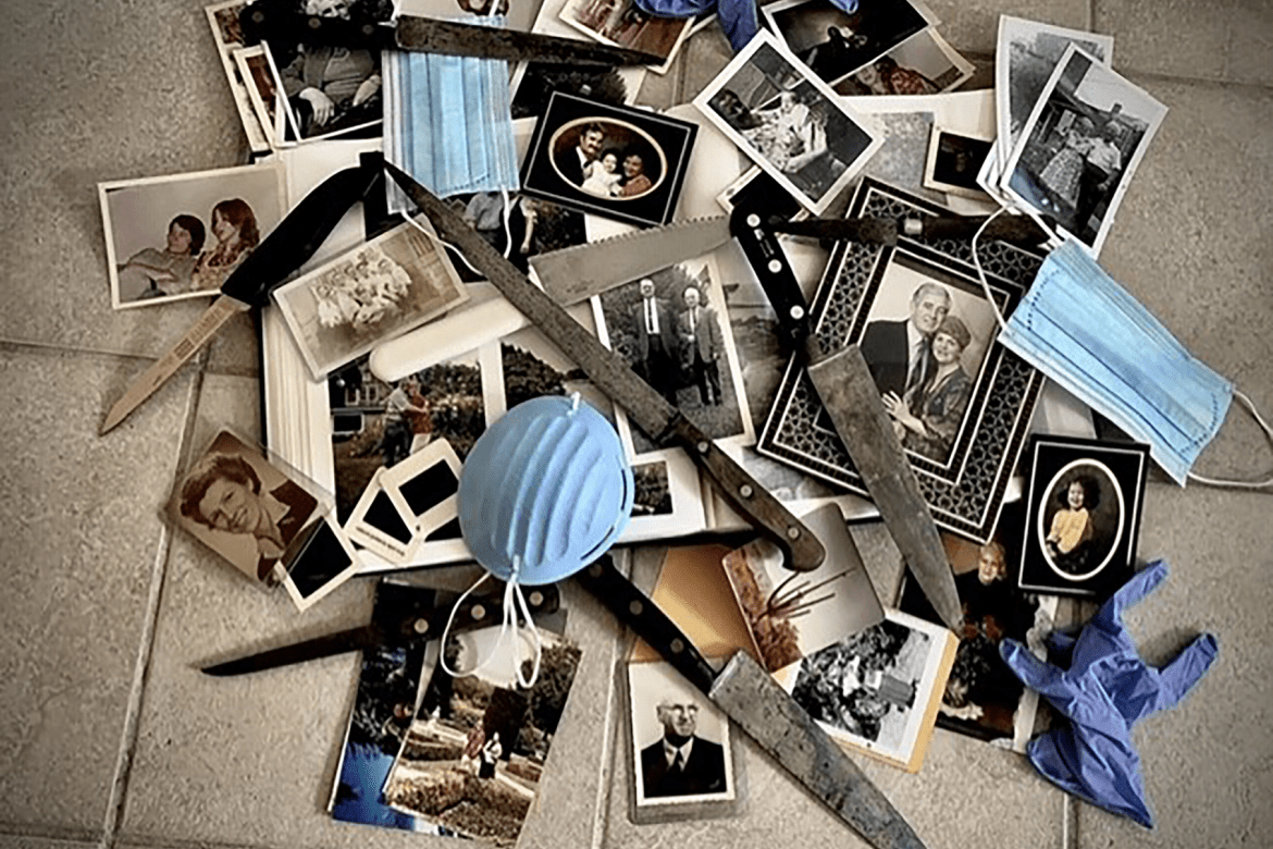 A collection of photos of friends and family piled up with surgical masks, gloves and knives