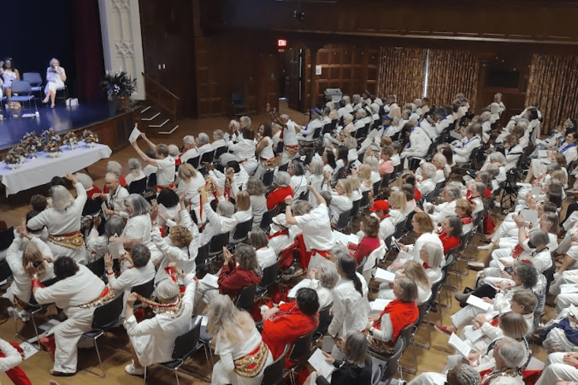 Alums seated in Chapin Auditorium for the annual meeting at Mount Holyoke College.