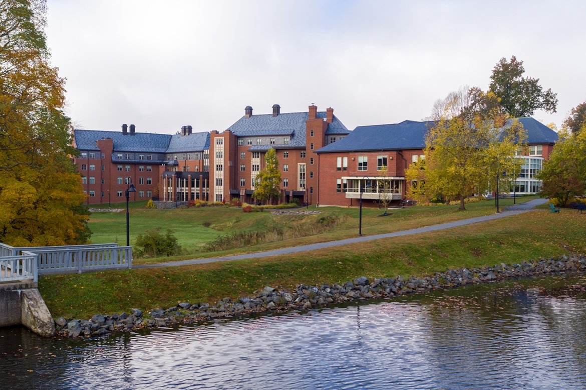 Mount Holyoke College campus in the early fall, where the leaves on the trees are just starting to turn colors.