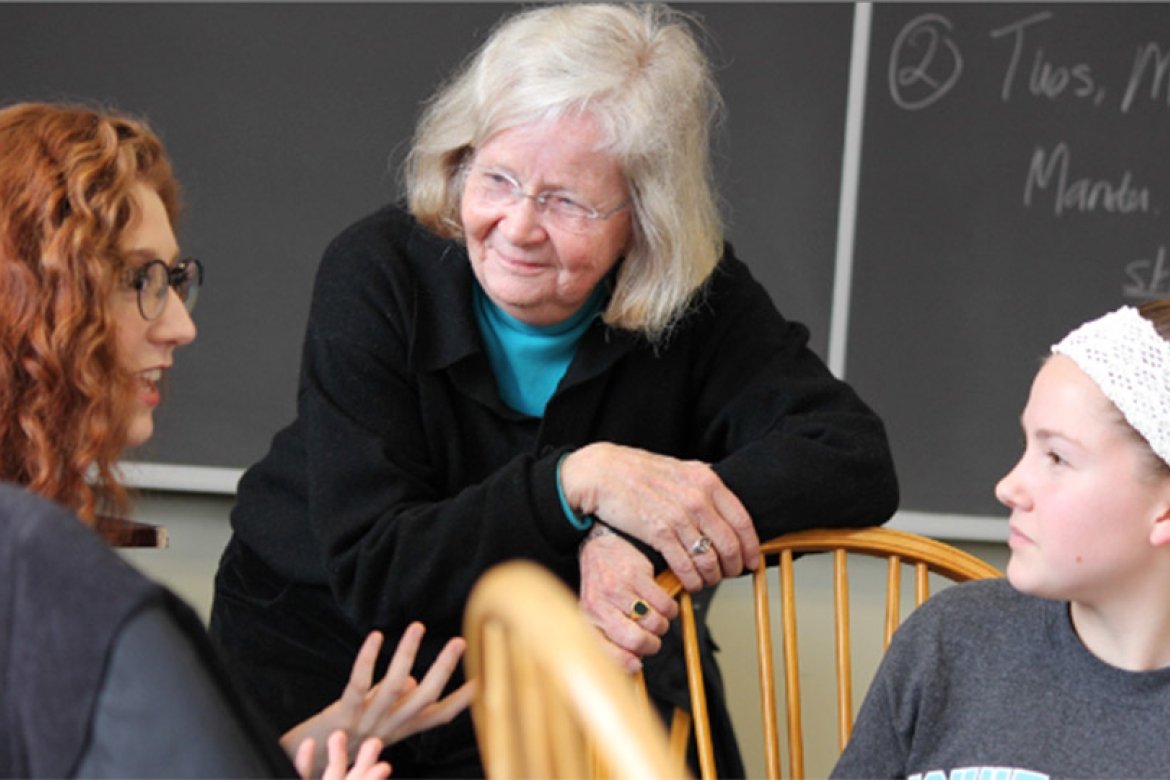 Professor Penny Gill speaks with students in her first-year seminar. Photo by John  Martins