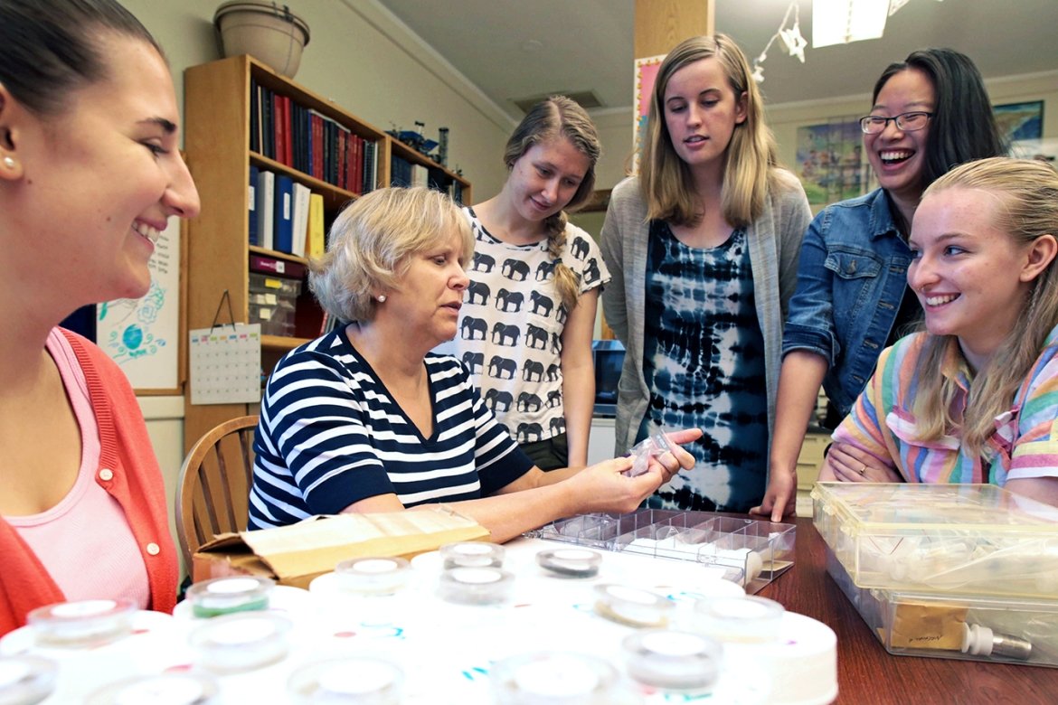 Dyar (in striped shirt, center) is one of a few select researchers who will study pristine lunar samples from the Apollo missions that have been hermetically sealed since they were collected on the Moon. 