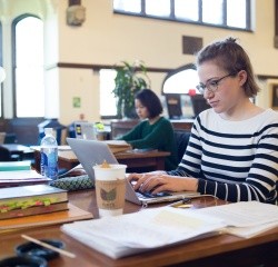 Students working in the reading room of the Williston library