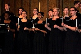 Vespers - students singing wearing all black and holding candles