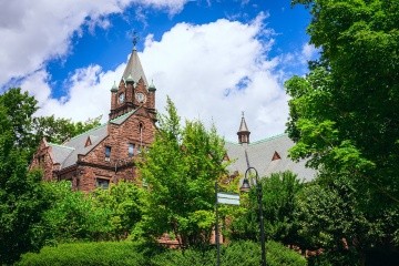 Clocktower in the Mary Lyon building on Mount Holyoke College's campus. Photo taken by Max Wilhelm, summer 2024.