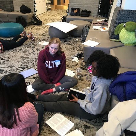 Intergroup Dialogue students sit in a circle and discuss.