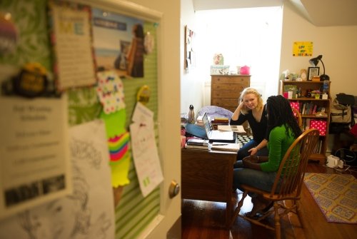 Two students talking in a residence hall room