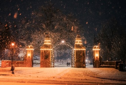 Mount Holyoke College gates during a snowstorm at night