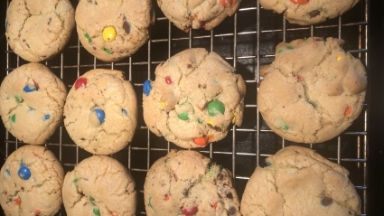 M&M cookies on a wire cooling rack
