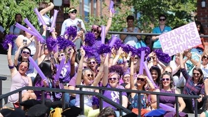 Frances Perkins students, in brilliant purple, cheer in the academic year during the Convocation ceremony.