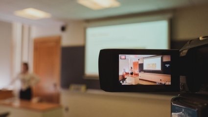 A student presentation at LEAP 2018 as seen through the viewfinder of a video camera. 