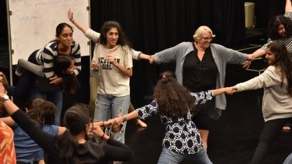 MHC Shakti students in a circle with Sonya Stephens