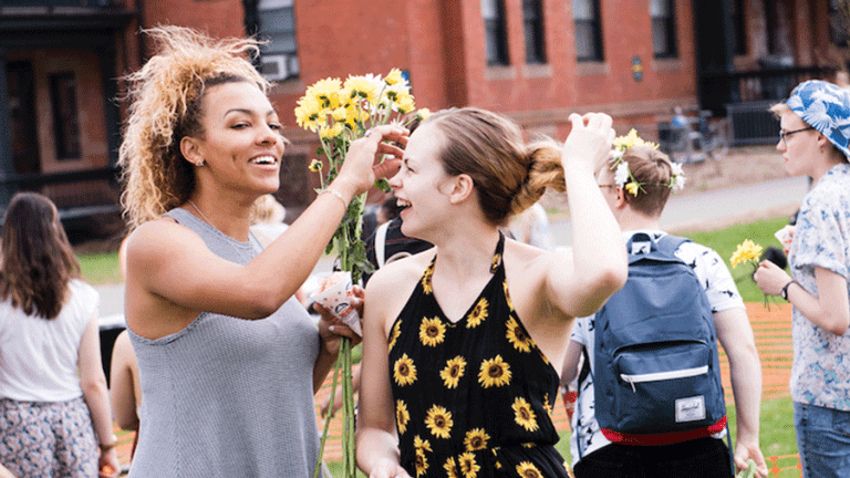 Photo of students with flowers on Pangy Day.