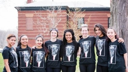 A group of students wearing identical t-shirts