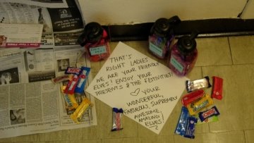 Photo of elfing gifts outside a door