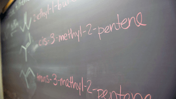 Chemistry terms written on a chalkboard