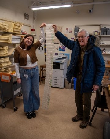 Emma Backbier '27 and Christopher Hoogendyk hold one of the letters written by David Crockett Graham.